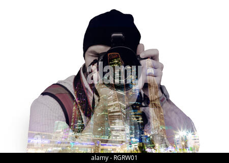 Double Exposure, ein Mann, der Fotografie und der modernen Großstadt bei Nacht Hintergrund Stockfoto