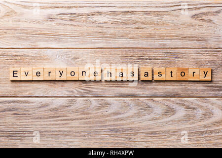 Jeder hat eine Geschichte Wort auf Holz Block geschrieben. Jeder hat eine Geschichte text auf Holz- Tabelle für Ihr Design, Konzept. Stockfoto