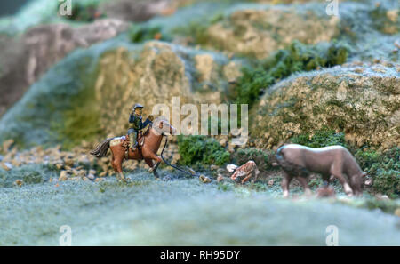 Ansicht des Mini Spielzeug Cowboy in der Tierhaltung. Stockfoto