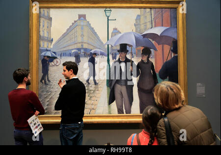 Besucher genießen die 'Paris Street; regnerischen Tag' (Rue de Paris, temps de pluie) von Gustave Caillebotte in der Kunst Institut von Chicago. Chicago Illinois USA. Stockfoto