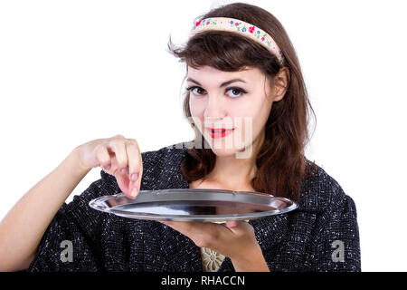 Retro Style Frau vorgibt, Pickup etwas aus einem Fach für Composites Stockfoto