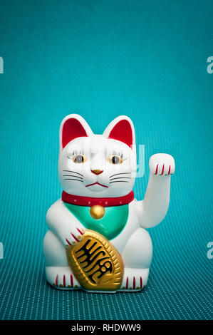 Maneki Neko - oder Beckoning Cat Stockfoto