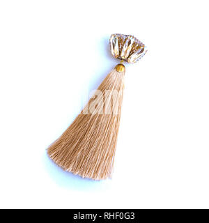 Handmade elegant brooch with a brush from silk threads and a rhinestone. Stockfoto