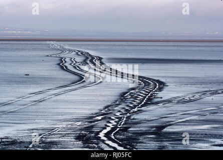 Schmierspuren auf einem leeren Morecambe Bay Landschaft Stockfoto