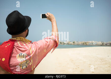 Mann Foto am Strand Stockfoto