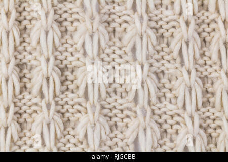 Gestrickte Textur - Ansicht von oben Foto von Stricken mit Muster Nahaufnahme - weg von der Farbe Weiß Stockfoto
