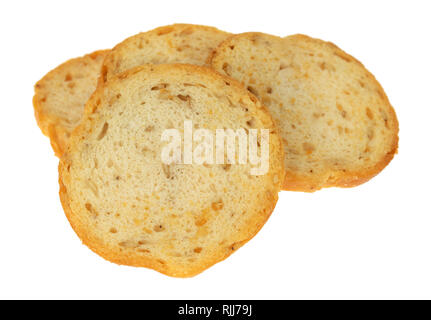 Vier Stücke von Sesam runde Melba Toast auf einem weißen Hintergrund. Stockfoto