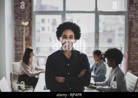 Portrait of African American businessman with his employees Stockfoto