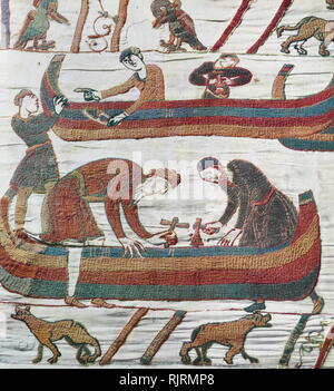 Episode aus dem Teppich von Bayeux, der bestickten Tuch fast 70 Meter (230 ft) lang, die die Ereignisse, die zu der Normannischen Eroberung Englands zeigt, die ihren Höhepunkt in der Schlacht von Hastings, in 1066. Es ist bis heute auf das 11. Jahrhundert dachte, nur wenige Jahre nach der Schlacht. Erzählt wird die Geschichte aus der Sicht der Normannen erobern. Stockfoto