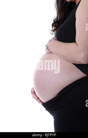 Seite Profil anzeigen Der junge schwangere Mutter mit den Händen halten Sie Ihr Baby im Bauch mit kopieren. Auf weissem Hintergrund. Stockfoto
