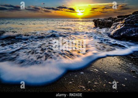 Küsten Sonnenauf- und -untergänge in Wales Stockfoto