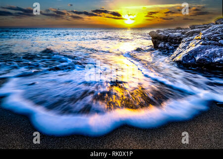 Küsten Sonnenauf- und -untergänge in Wales Stockfoto