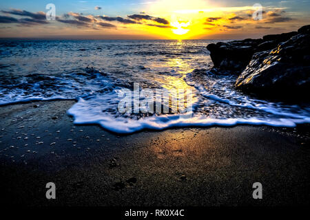 Küsten Sonnenauf- und -untergänge in Wales Stockfoto