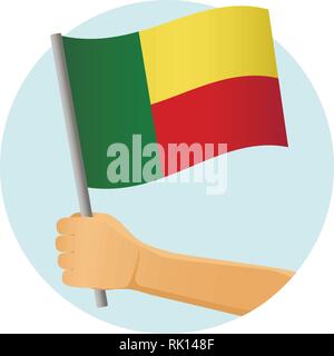 Benin Fahne in der Hand. Patriotischen Hintergrund. Nationalflagge von Benin Vector Illustration Stock Vektor