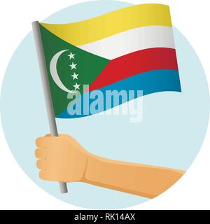 Komoren Fahne in der Hand. Patriotischen Hintergrund. Nationalflagge von Komoren Vector Illustration Stock Vektor