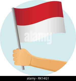 Indonesien Fahne in der Hand. Patriotischen Hintergrund. Nationalflagge von Indonesien Vector Illustration Stock Vektor