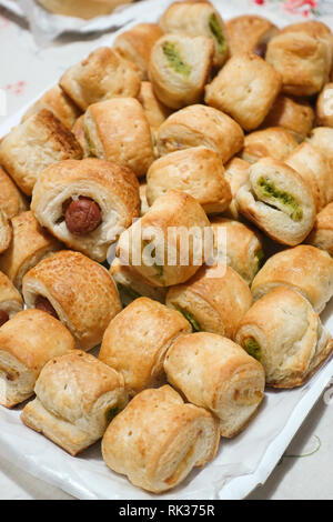 Decken mit verschiedenen Geschmacksrichtungen, Schweinefleisch, Spinat und Schinken. Stockfoto