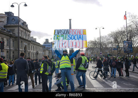 Paris, Frankreich. 09 Feb, 2019. Zahlen nicht fair Steuern ist eine soziale und ökologische Verbrechen, das ist das Zeichen hier geschrieben: Roger Ankri/Alamy leben Nachrichten Stockfoto