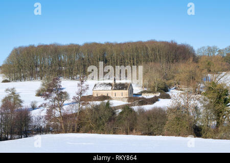 St. Oswalds Kirche im Winter Schnee. Widford, Cotswolds, Oxfordshire, England Stockfoto