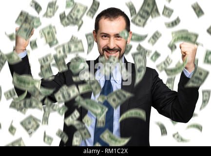 Glücklicher Mann genießen den Regen des Geldes Stockfoto