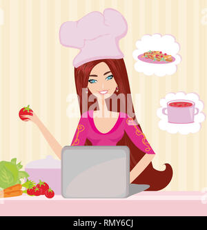 Hausfrau in Laptop suchen beim Abendessen Stockfoto