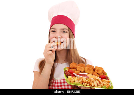 Mädchen kochen isst, Chicken Nuggets und Pommes Frites Stockfoto