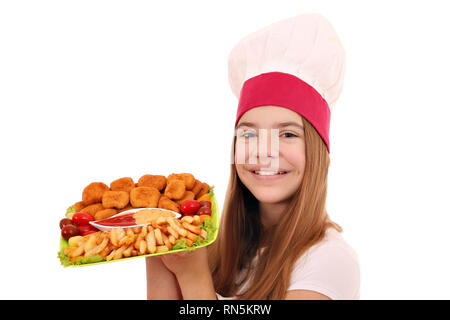 Mädchen Kochen mit Chicken Nuggets und Pommes Frites Stockfoto