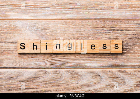 Schindeln Wort auf Holz Block geschrieben. Schindeln text auf Holz- Tabelle für Ihr Design, Konzept. Stockfoto
