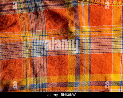 Orange und gelb karierte Drucken als Hintergrund. Scottish tartan Muster. Symmetrische rhombus Muster. Stockfoto