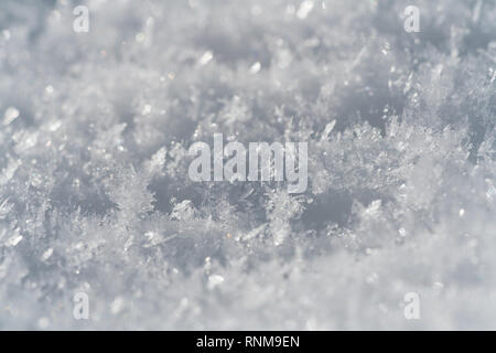 Schneeflocken Close Up Abstract an einem sonnigen Tag Stockfoto