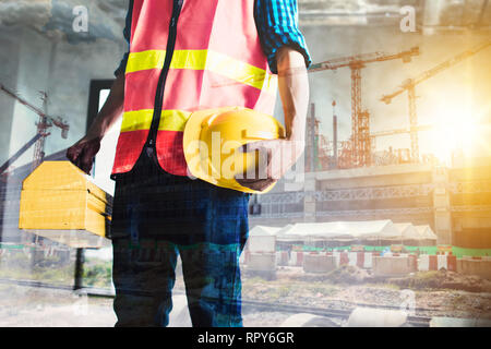 Double Exposure Bauarbeiter mit Baustelle Stockfoto