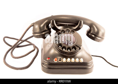 Altes Telefon auf weißem Hintergrund Stockfoto