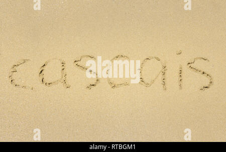 Inschrift auf nassem Sand Cascais. Stockfoto