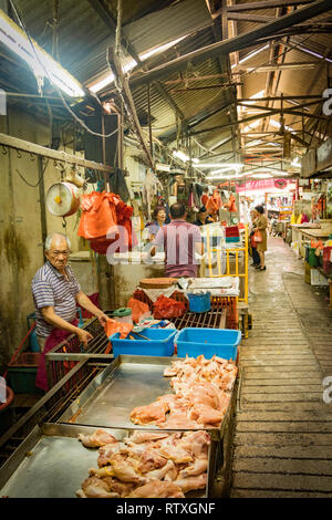 Metzger auf dem Markt in Chinatown, Kuala Lumpur, Malaysia Abschaltdruck Stockfoto