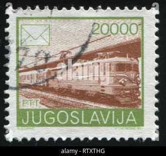 Russland KALININGRAD, 12. NOVEMBER 2016: Briefmarke von Jugoslawien gedruckt, zeigt Mail Zug, ca. 1986 Stockfoto