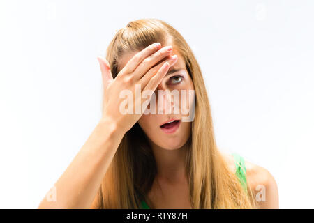 Junge Frau, die Kopfschmerzen Stockfoto