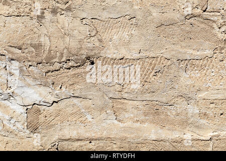 Alte beige Steinmauer, frontale Hintergrund Foto Textur Stockfoto