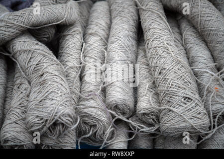 Gray knitting yarn balls stacked on top of each other Stockfoto