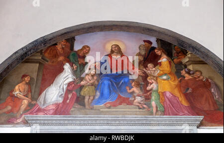 Jesus segnet die Kinder, mit Fresken verzierte Lunette, Ospedale degli Innocenti - Außen Arcade, Florenz, Italien Stockfoto