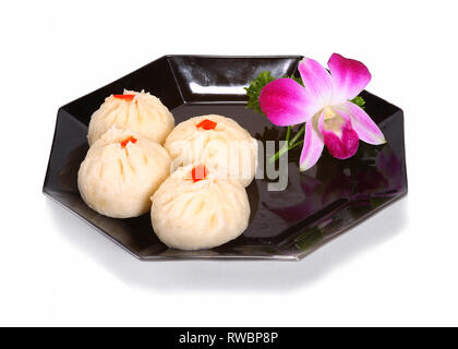 Chinesisch/asiatischen Desserts serviert auf einer schwarzen Platte. Stockfoto