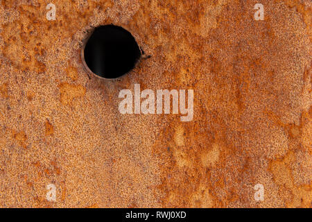 Alte Distressed Brown Terracotta Kupfer Rusty Stein mit groben Textur bunte Einschlüsse. Gebeizt Gradient Grob körnige Oberfläche Stockfoto