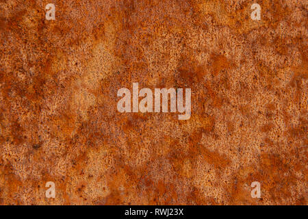 Alte Distressed Brown Terracotta Kupfer Rusty Stein mit groben Textur bunte Einschlüsse. Gebeizt Gradient Grob körnige Oberfläche Stockfoto