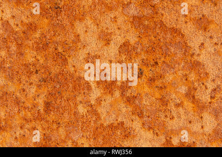Alte Distressed Brown Terracotta Kupfer Rusty Stein mit groben Textur bunte Einschlüsse. Gebeizt Gradient Grob körnige Oberfläche Stockfoto