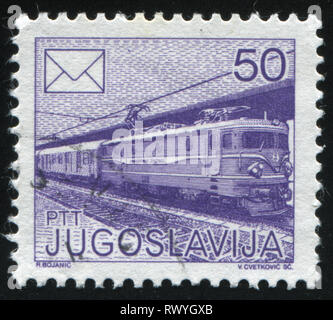 Russland KALININGRAD, 12. NOVEMBER 2016: Briefmarke von Jugoslawien gedruckt, zeigt Mail Zug, ca. 1986 Stockfoto