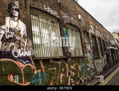 Mick Jagger Schablone Kunst auf Graffiti verkleideten Wände der spitlefied, East London. Stockfoto