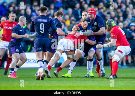 Das Stadion Murrayfield, Edinburgh, Großbritannien. 9 Mär, 2019. Guinness sechs Nationen Rugby, Schottland gegen Wales; Byron McGuigan von Schottland in Angriff genommen wird: Aktion plus Sport/Alamy leben Nachrichten Stockfoto