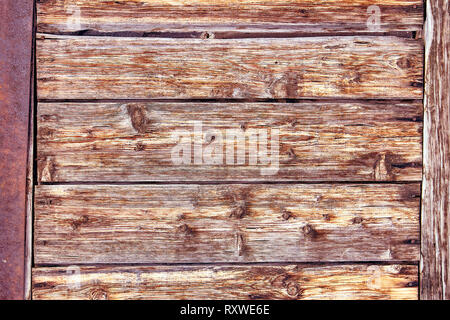 Alte Distressed Brown Terracotta Kupfer Rusty Holz- Hintergrund mit groben Textur bunte Einschlüsse. Gebeizt Gradient Grob körnige Oberfläche. Stockfoto