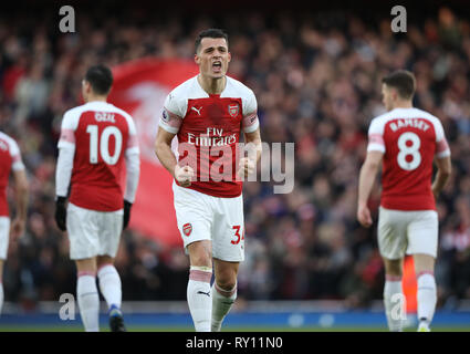 London, Großbritannien. 10 Mär, 2019. Granit Xhaka (A) feiert das Zählen der erste Arsenal Ziel (1-0) im Arsenal v Manchester United Fußball der englischen Premier League match Im Emirates Stadium, London, am 10. März 2019. ** Nur die redaktionelle Nutzung, eine Lizenz für die gewerbliche Nutzung erforderlich. Keine Verwendung in Wetten, Spiele oder einer einzelnen Verein/Liga/player Publikationen ** Quelle: Paul Marriott/Alamy leben Nachrichten Stockfoto