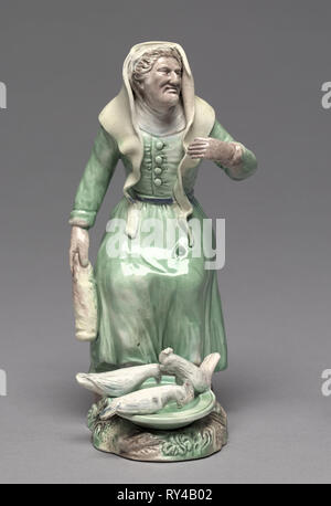 Alte Frau Hühner füttern, C. 1770. Staffordshire Factory (britische). Steingut; Insgesamt: 19,7 cm (7 3/4 in Stockfoto