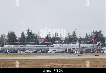 Vancouver, Kanada. 13 Mär, 2019. Zwei Air Canada Boeing 737 Max. 8 Flugzeuge sind in Vancouver International Airport in Richmond, Vancouver, Kanada, März 13, 2019 gesehen. Kanada ist Erdung alle Boeing 737 Max. 8 und 9 Flugzeuge und das Verbot der Jets aus seinen Luftraum nach der Ethiopian Airlines Crash, dass alle 157 Menschen an Bord, darunter 18 Kanadier getötet. Credit: Liang Sen/Xinhua/Alamy leben Nachrichten Stockfoto